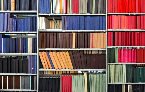 paper academic journals on a library shelf